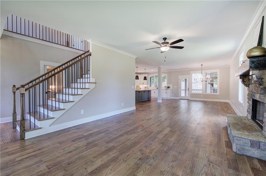 10 Dove Pointe Euharlee, GA 30145 - Photo 13 of 61 a view of an empty room with wooden floor and a ceiling fan