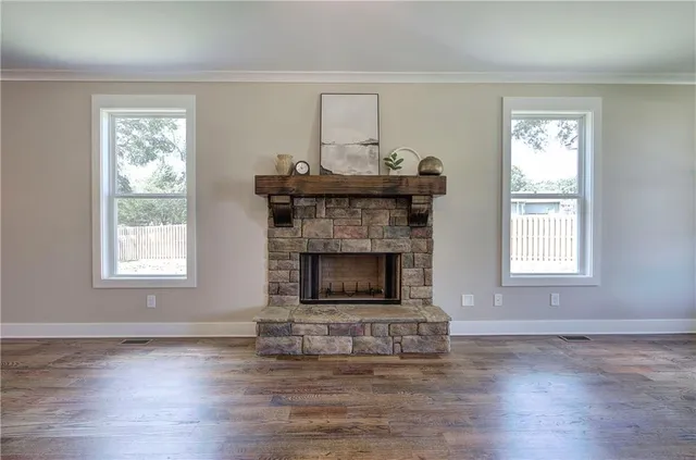 a large kitchen with stainless steel appliances granite countertop a stove and a sink