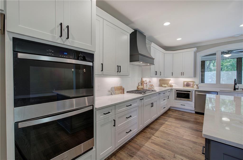 10 Dove Pointe Euharlee, GA 30145 - Photo 18 of 61 a large kitchen with stainless steel appliances granite countertop a stove and a sink