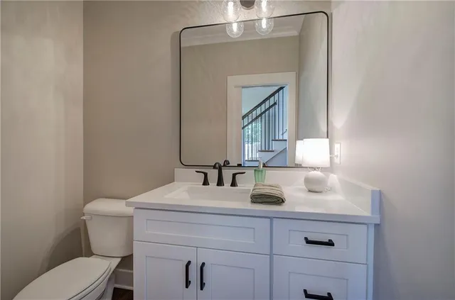 a view of a bathroom with a tub mirror and window