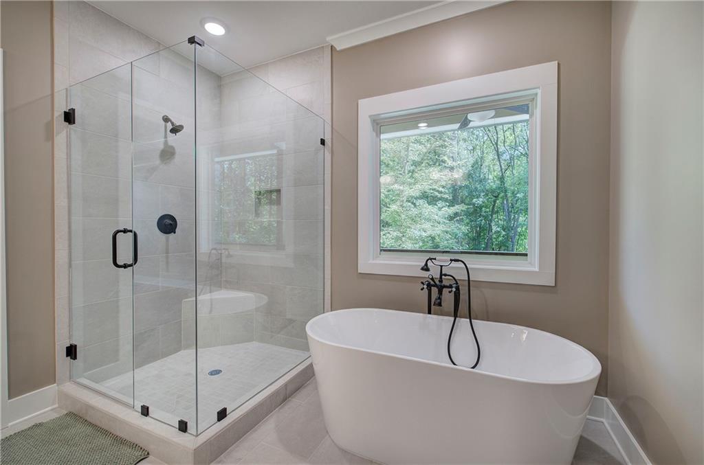10 Dove Pointe Euharlee, GA 30145 - Photo 29 of 61 a white bath tub sitting next to a shower