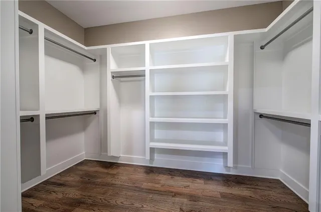 a bathroom with a toilet a sink and a mirror