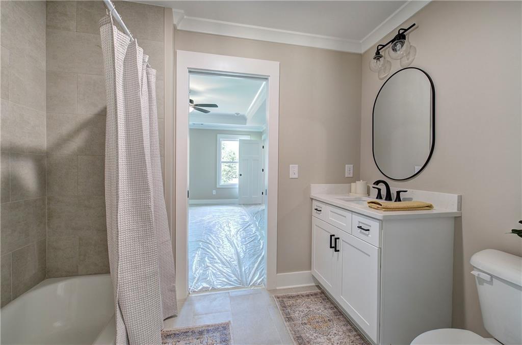 10 Dove Pointe Euharlee, GA 30145 - Photo 34 of 61 a bathroom with a toilet a sink and a mirror