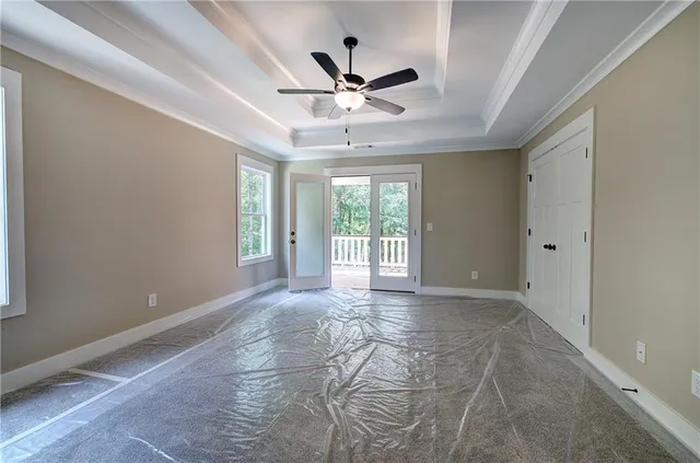a kitchen with granite countertop stainless steel appliances white cabinets and a sink