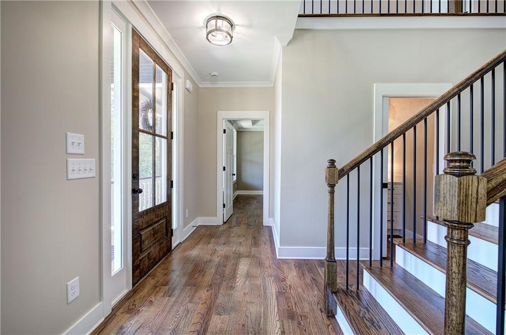 10 Dove Pointe Euharlee, GA 30145 - Photo 42 of 61 a view of a hallway with wooden floor and staircase