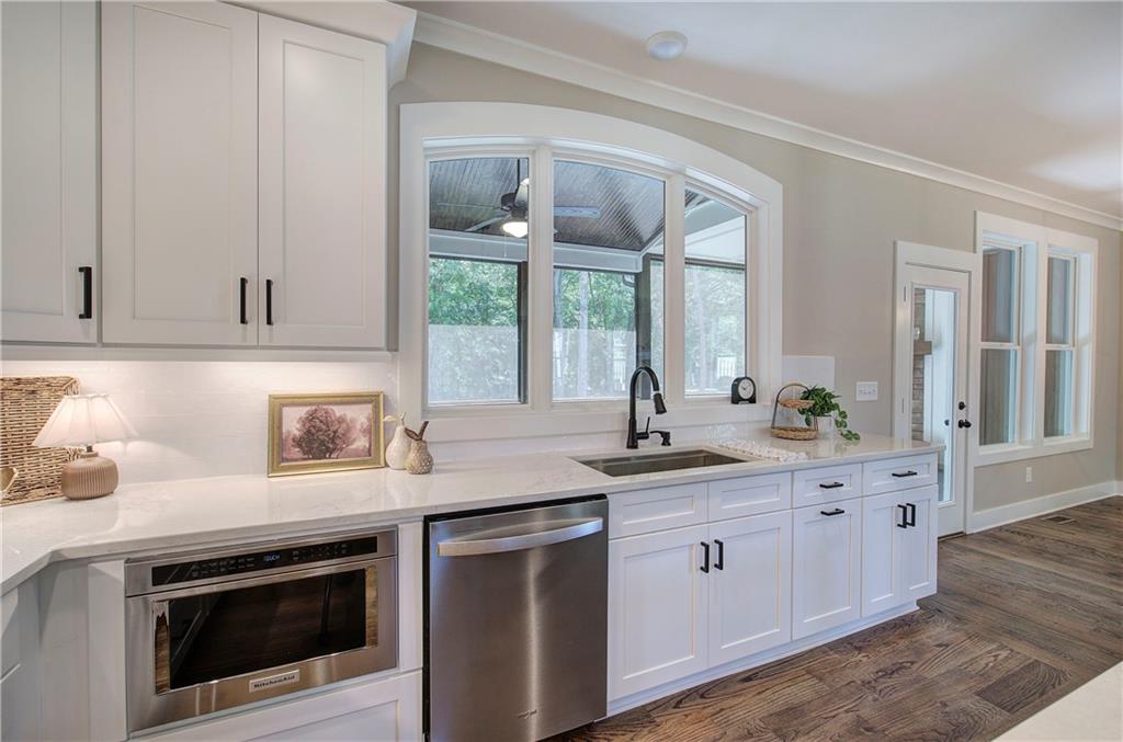 10 Dove Pointe Euharlee, GA 30145 - Photo 44 of 61 a kitchen with granite countertop stainless steel appliances white cabinets and a sink
