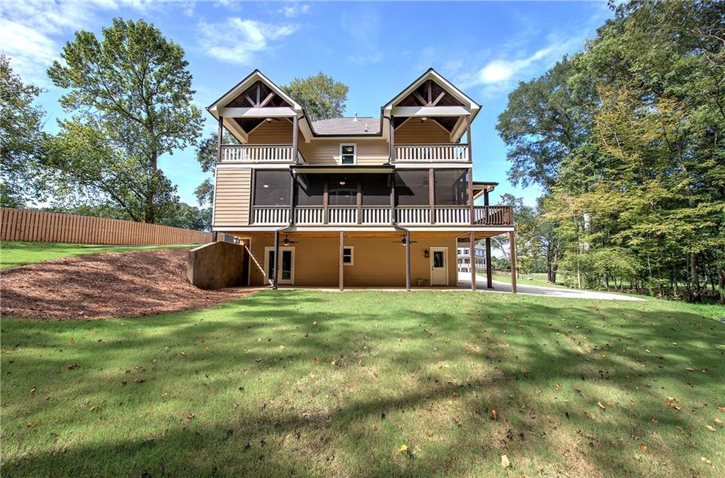 10 Dove Pointe Euharlee, GA 30145 - Photo 58 of 61 a front view of house with yard and trees in the background