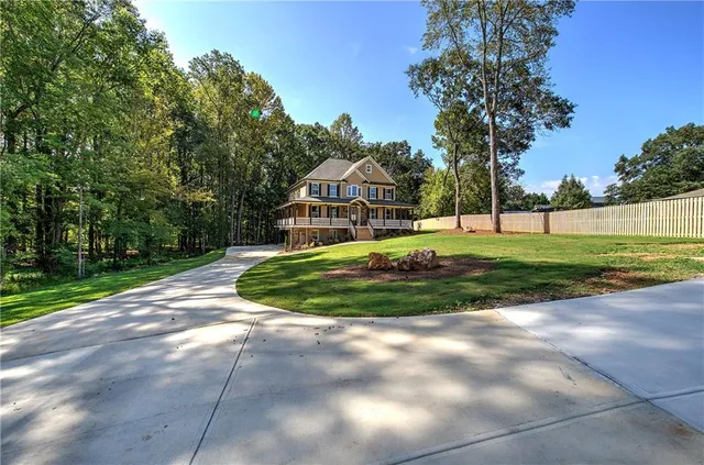 a view of a porch with wooden floor and outdoor space