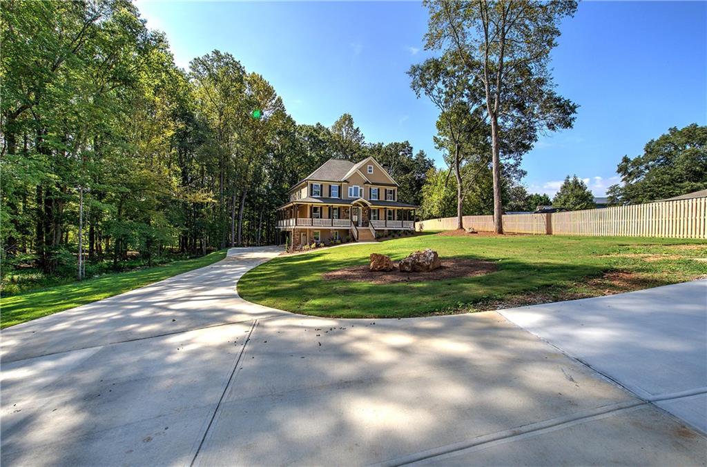 10 Dove Pointe Euharlee, GA 30145 - Photo 6 of 61 a view of a house with a big yard and palm trees