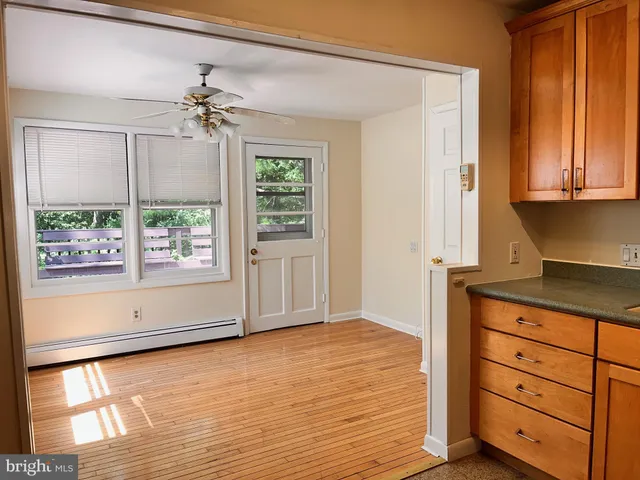 a view of an empty room with a window