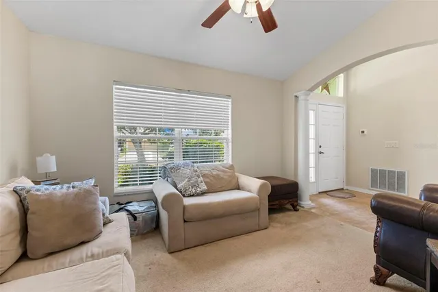 a living room with furniture and a large window