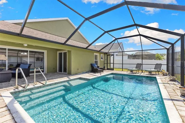 a view of pool with a patio