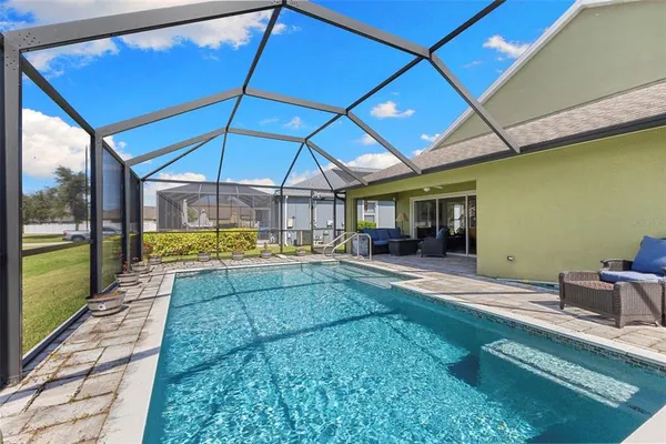 a view of swimming pool with a patio
