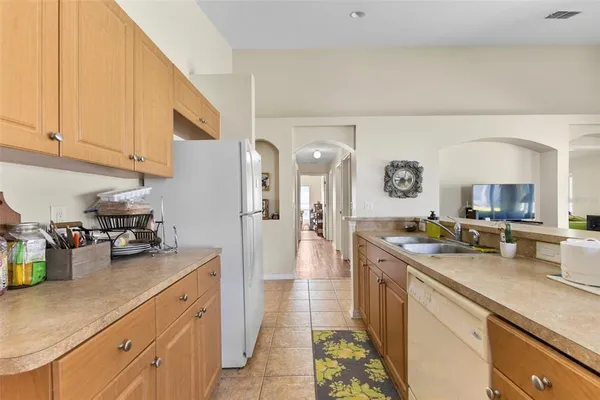a view of a kitchen with a sink and cabinets