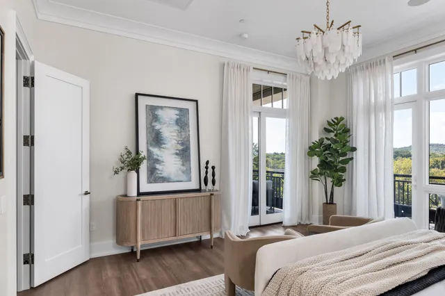 a large bed in a white bedroom
