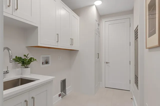 a table with a vase and flowers on it