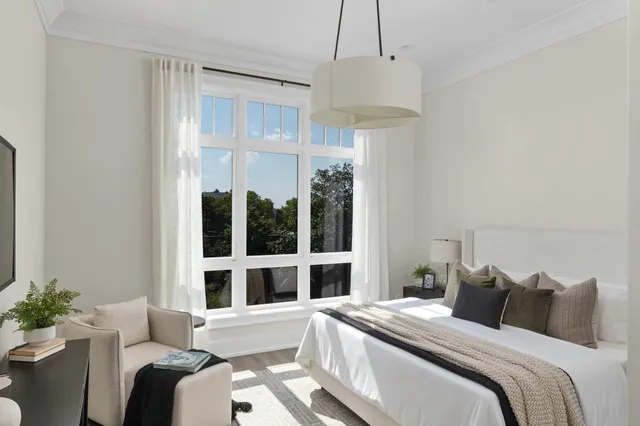 a view of a house with a small yard and a table and chairs