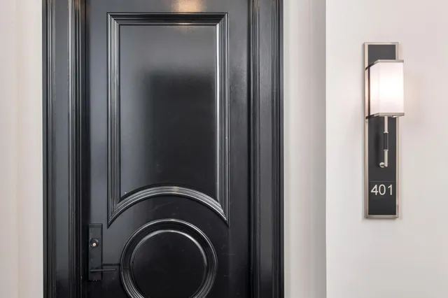 a very nice looking room with wooden floor and furniture