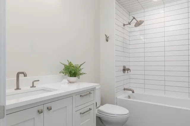 a living room with fireplace furniture and a floor to ceiling window