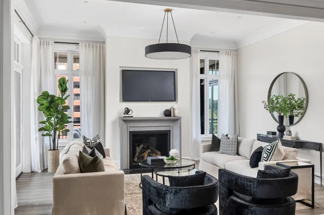 a view of kitchen with kitchen island stainless steel appliances refrigerator stove dining table and chairs