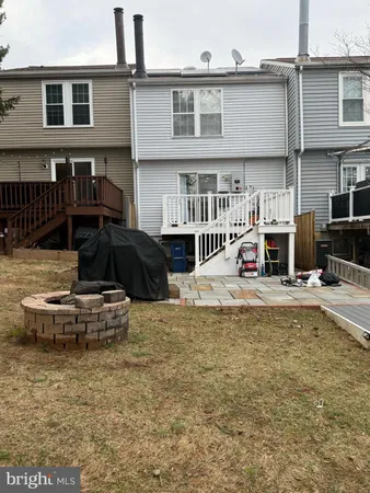 a view of a balcony with wooden floor and fence