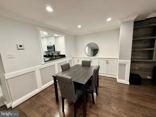 a kitchen with a table and chairs in it