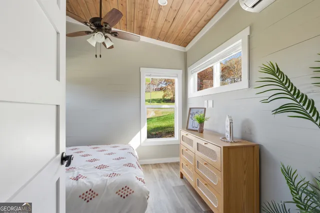 a bedroom with a bed and a dresser