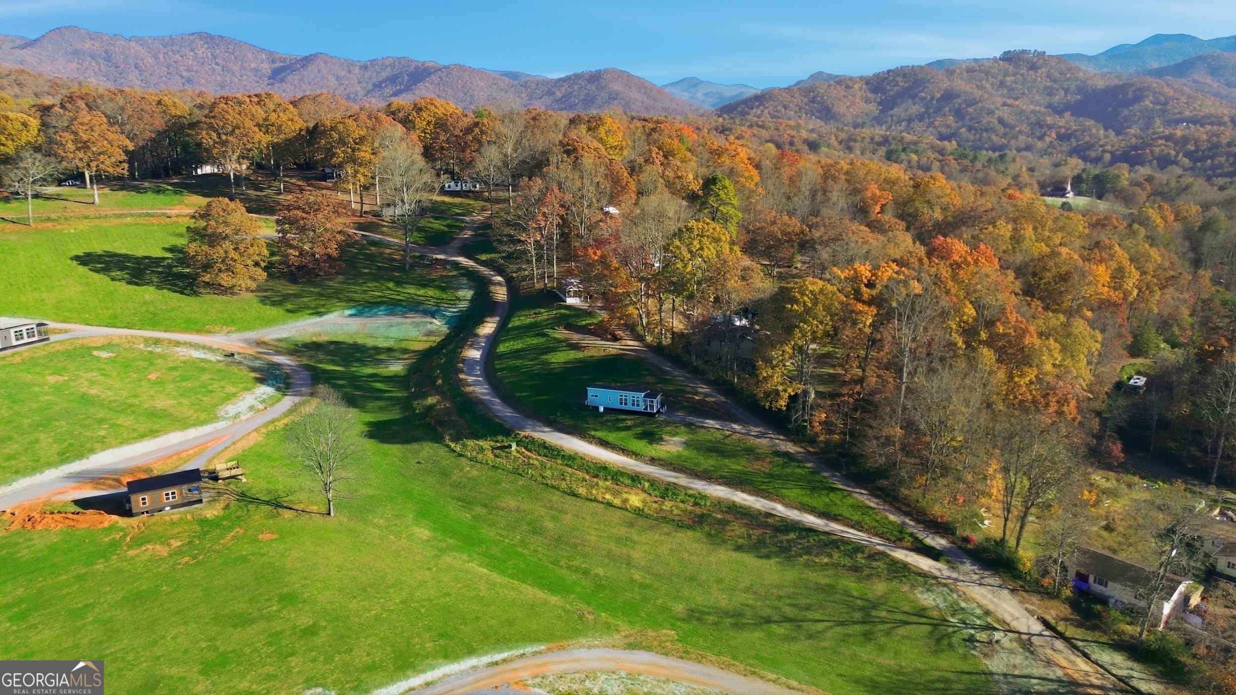 527 Saunders Road Franklin, NC 28734 - Photo 16 of 16 a view of a mountain with a yard