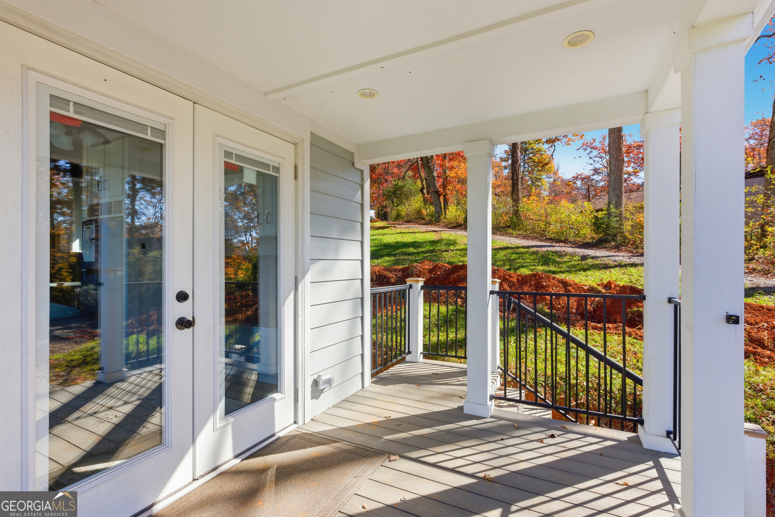 527 Saunders Road Franklin, NC 28734 - Photo 2 of 16 a view of a porch with a floor to ceiling window