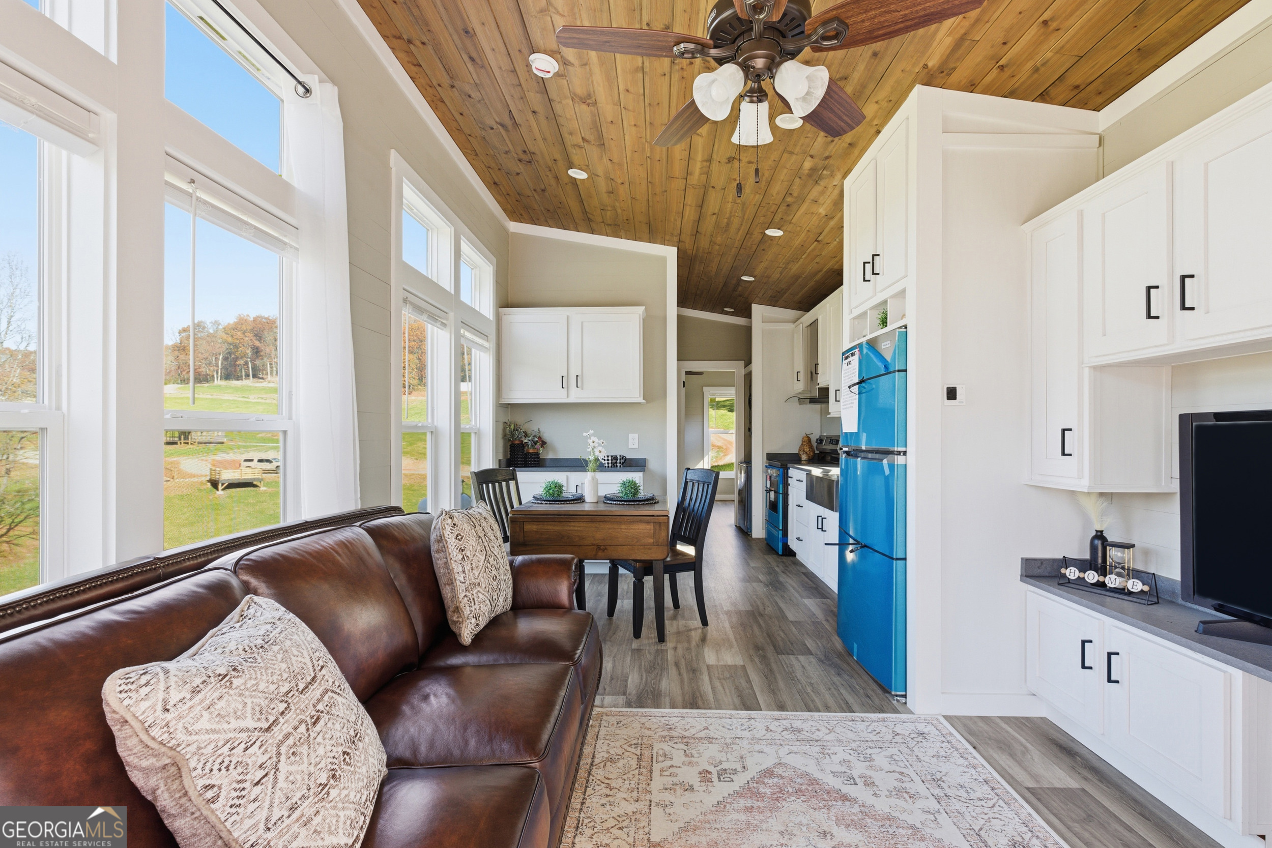 527 Saunders Road Franklin, NC 28734 - Photo 5 of 16 a living room with furniture and a flat screen tv