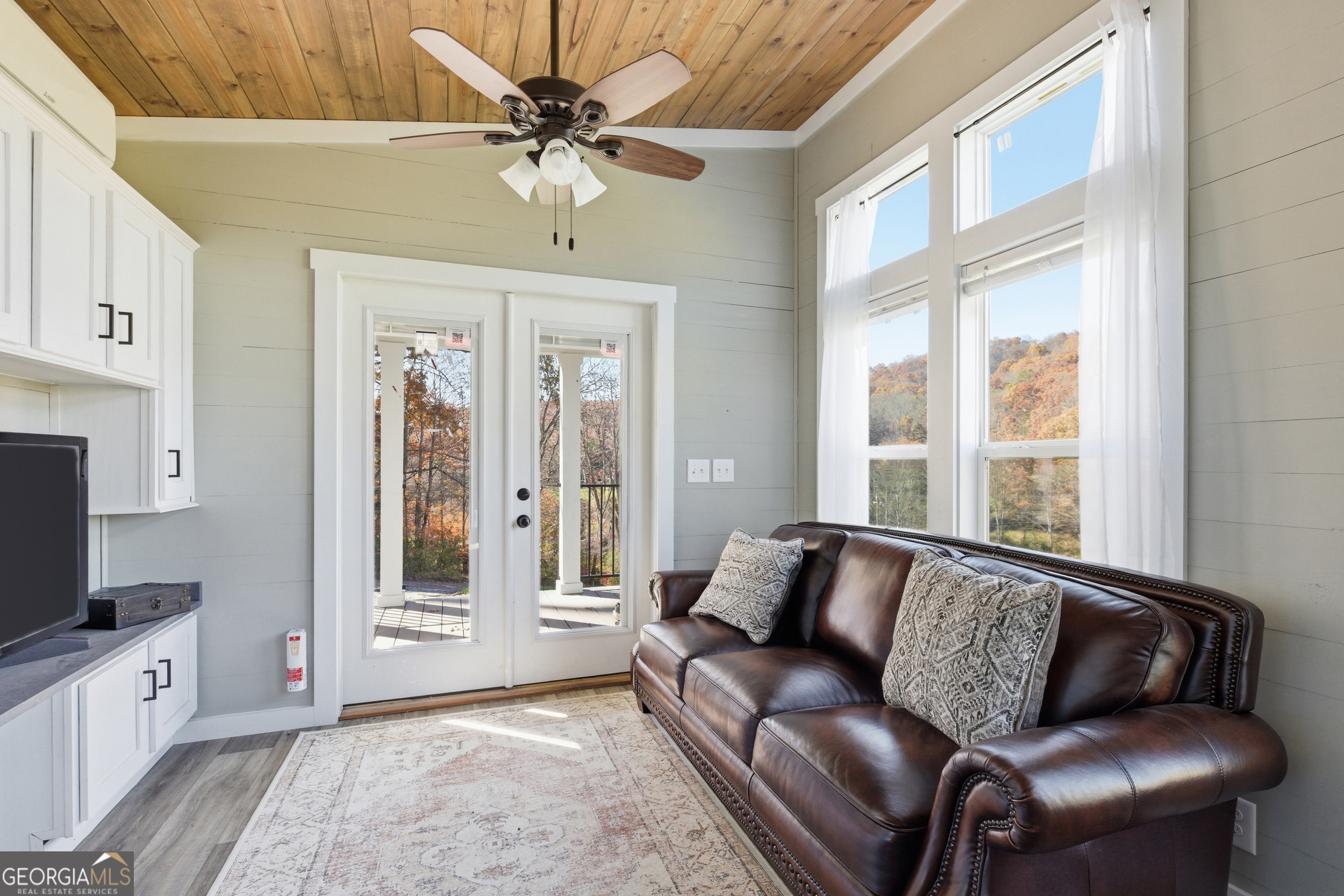 527 Saunders Road Franklin, NC 28734 - Photo 6 of 16 a living room with furniture and a flat screen tv