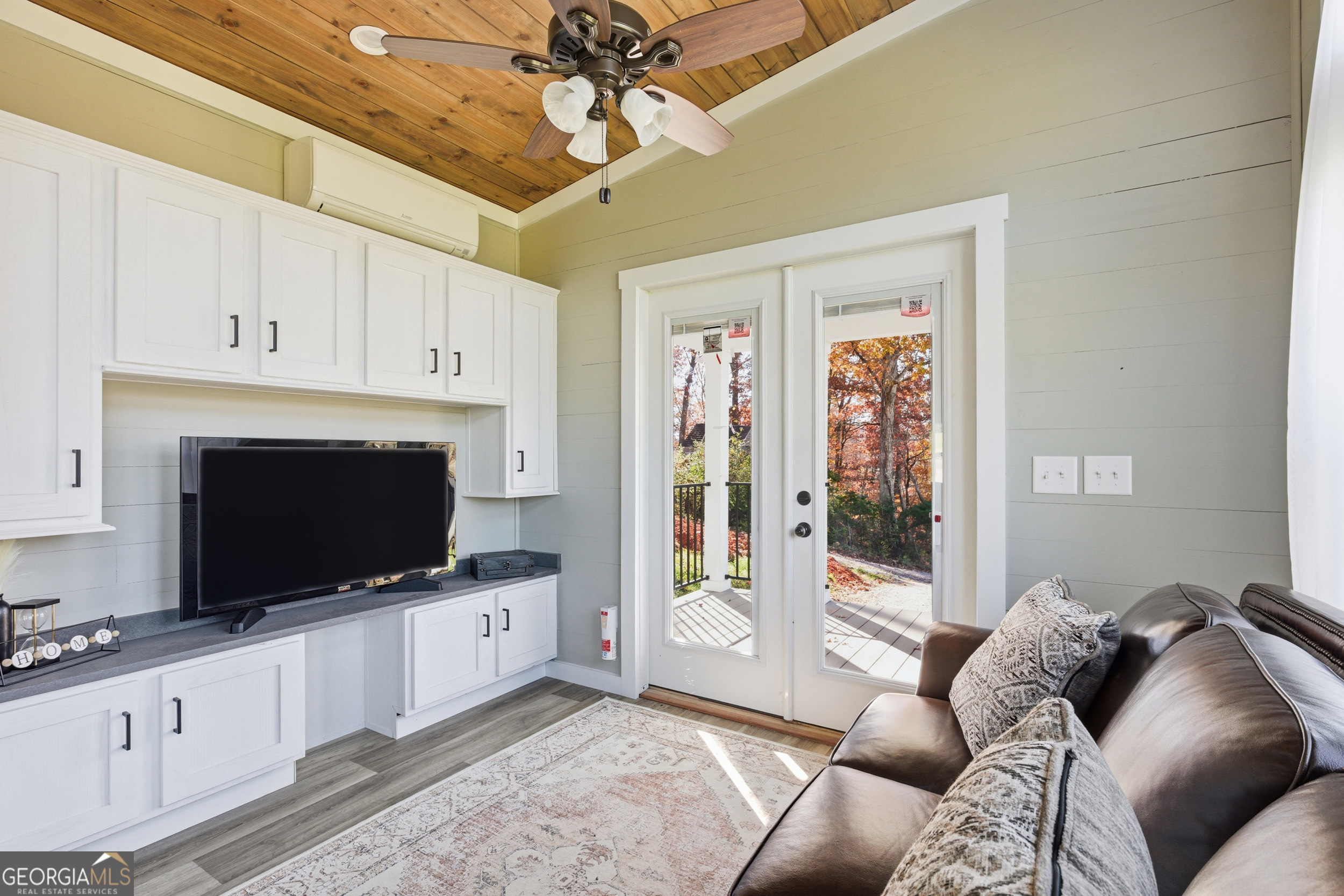 527 Saunders Road Franklin, NC 28734 - Photo 7 of 16 a living room with furniture and a flat screen tv
