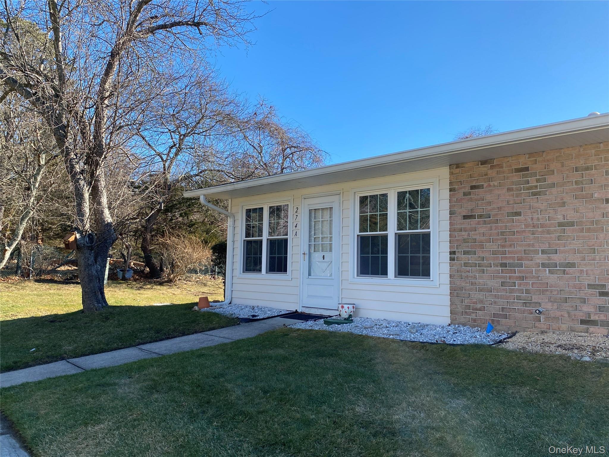 a view of house with backyard