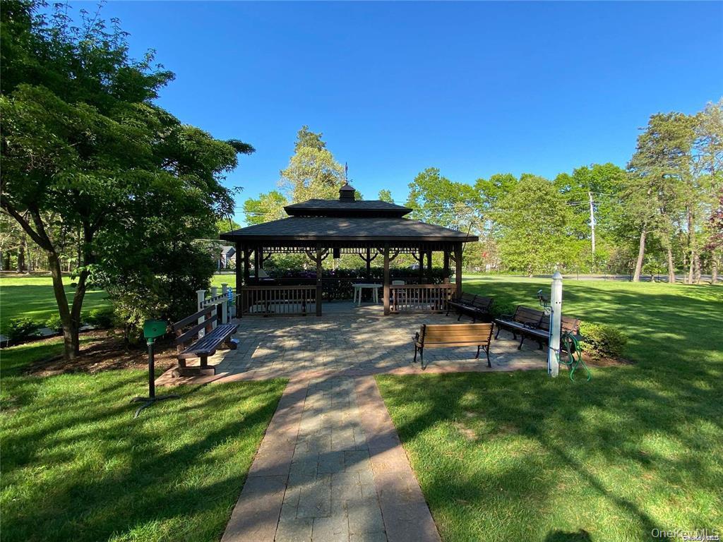 274 Berwick Court, Unit A Ridge, NY 11961 - Photo 12 of 26 a view of a park with plants and trees