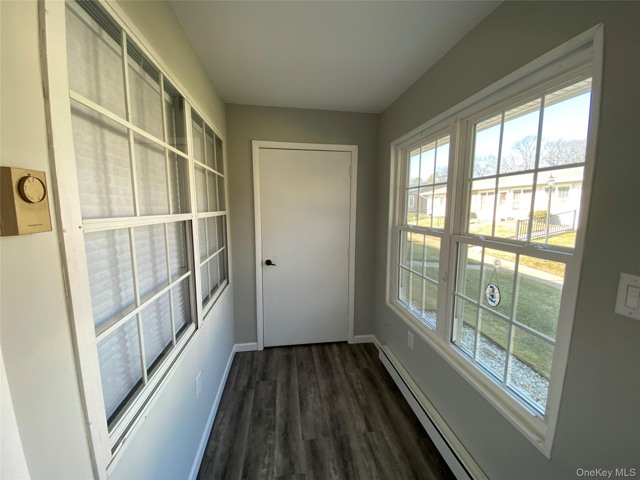 274 Berwick Court, Unit A Ridge, NY 11961 - Photo 13 of 26 a view of entryway with wooden floor