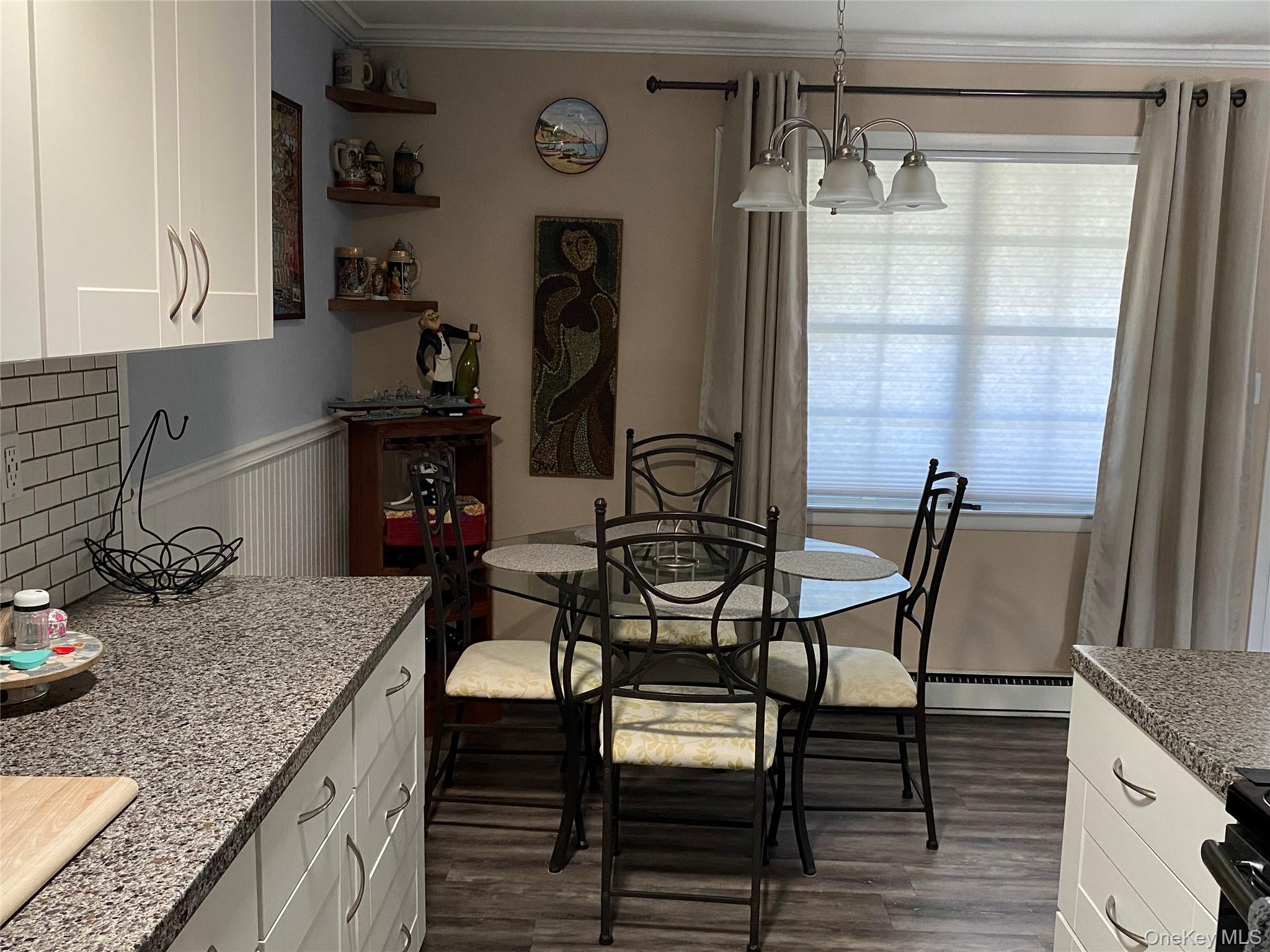 274 Berwick Court, Unit A Ridge, NY 11961 - Photo 18 of 26 a kitchen with granite countertop sink and cabinets