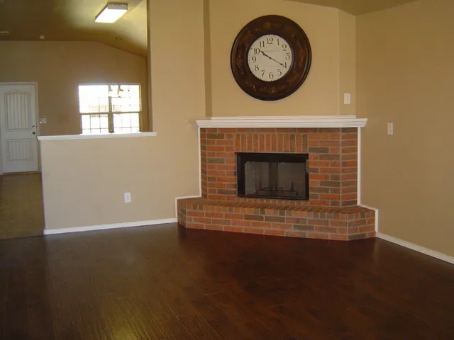 a view of a livingroom with furniture and a fireplace