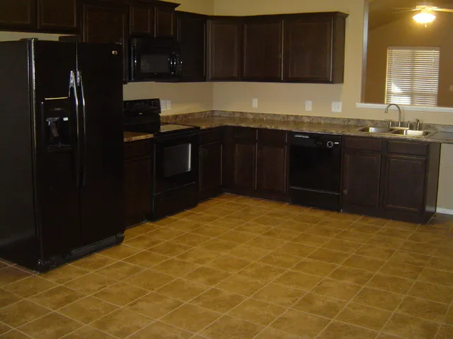 a kitchen with a sink and cabinets