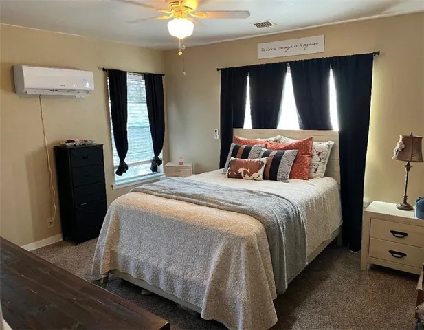 a bedroom with a bed and a mirror