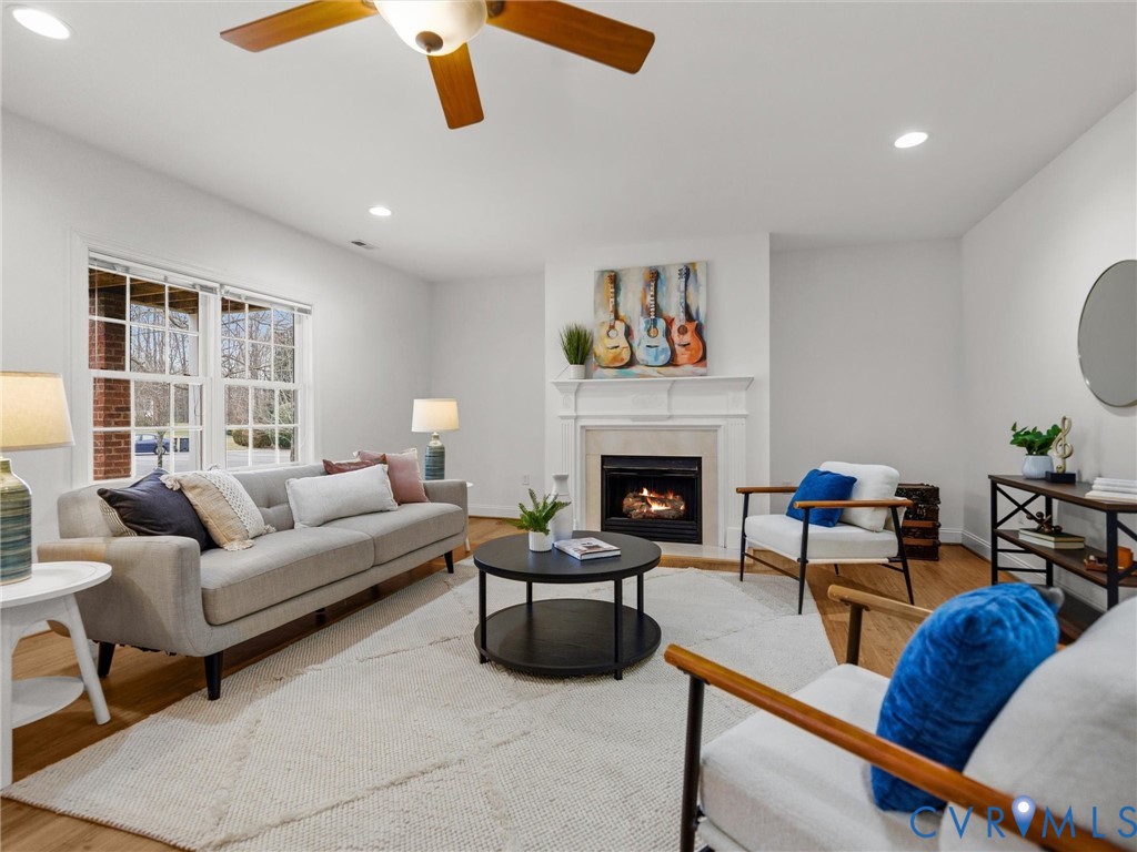 14335 Lander Road Midlothian, VA 23113 - Photo 60 of 70 a living room with furniture and a fireplace