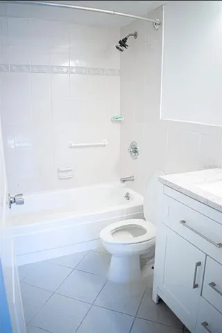 a bathroom with a sink a toilet and bathtub