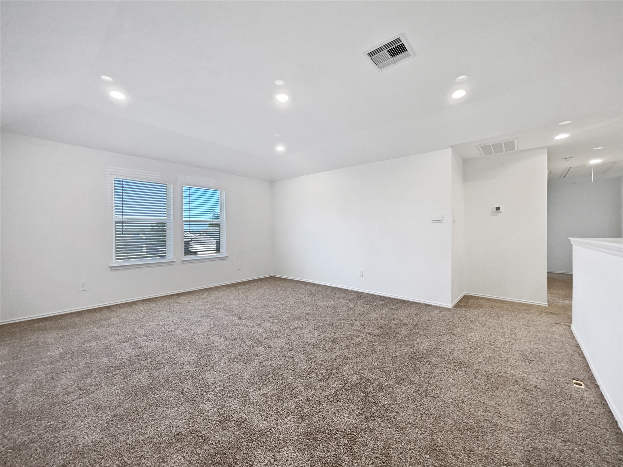 13912 Acadia Point Court Conroe, TX 77384 - Photo 14 of 19 an empty room with a empty space and windows