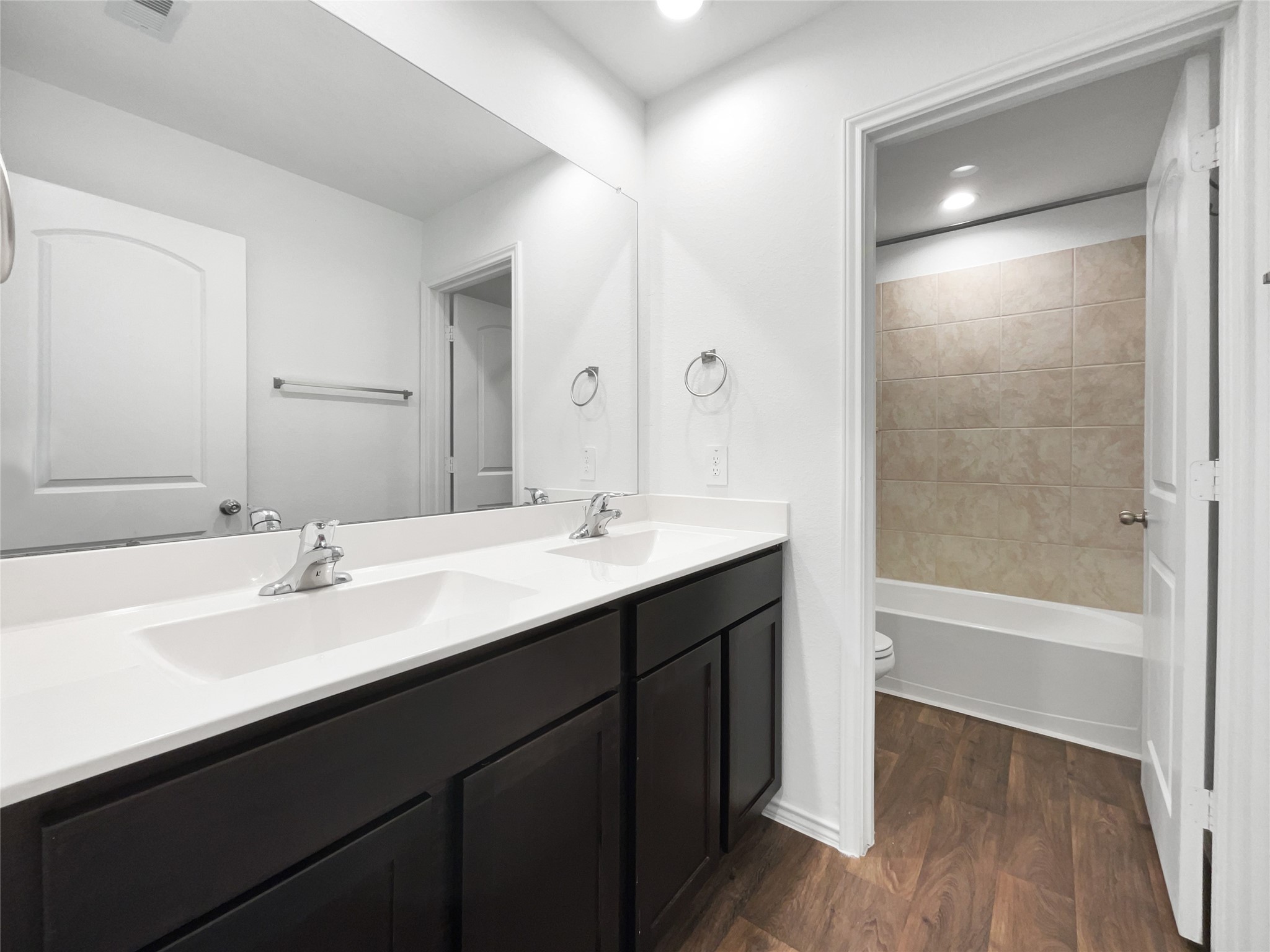 13912 Acadia Point Court Conroe, TX 77384 - Photo 16 of 19 a bathroom with a sink double vanity granite tub shower and a mirror