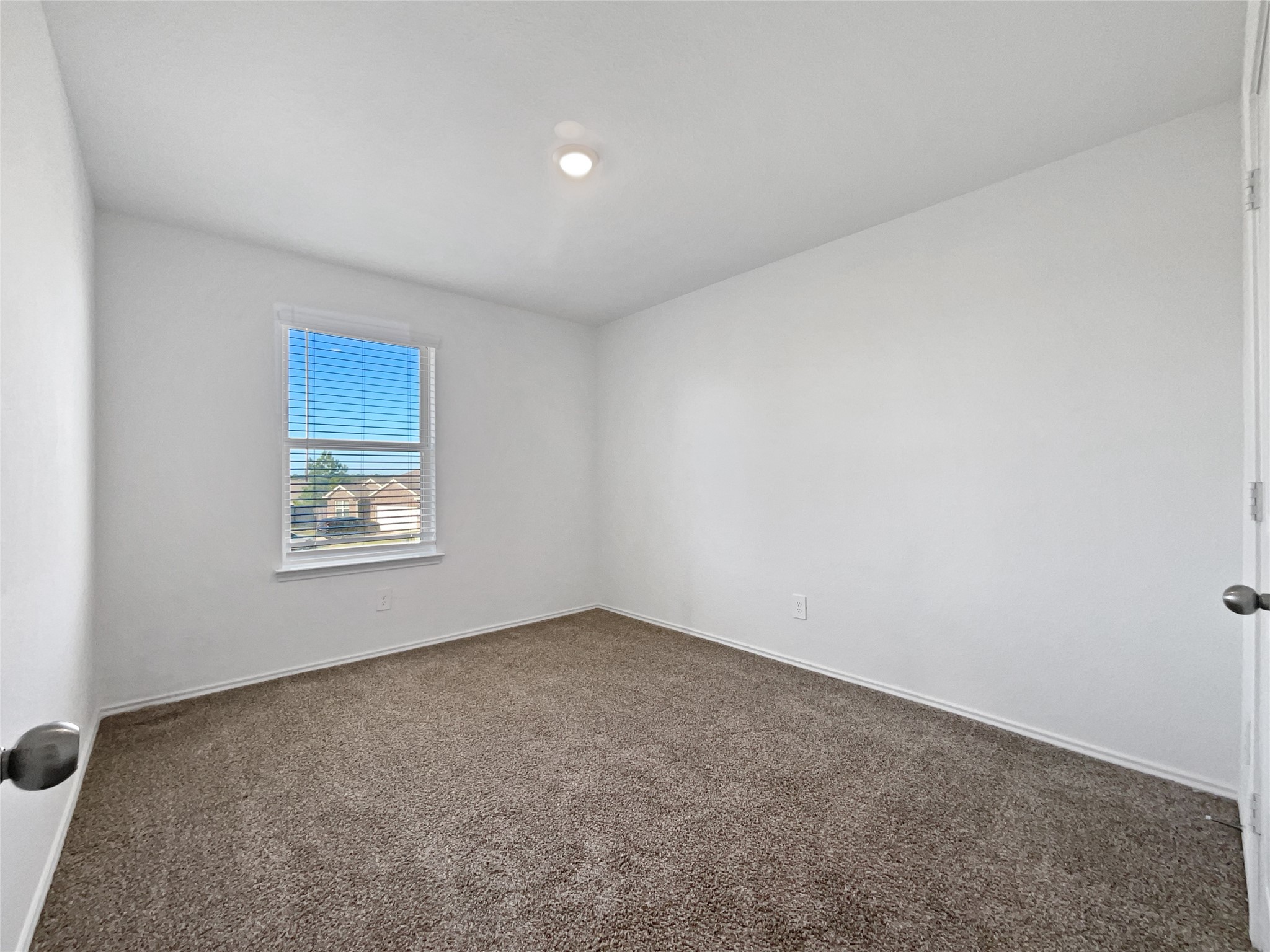 13912 Acadia Point Court Conroe, TX 77384 - Photo 18 of 19 an empty room with a window