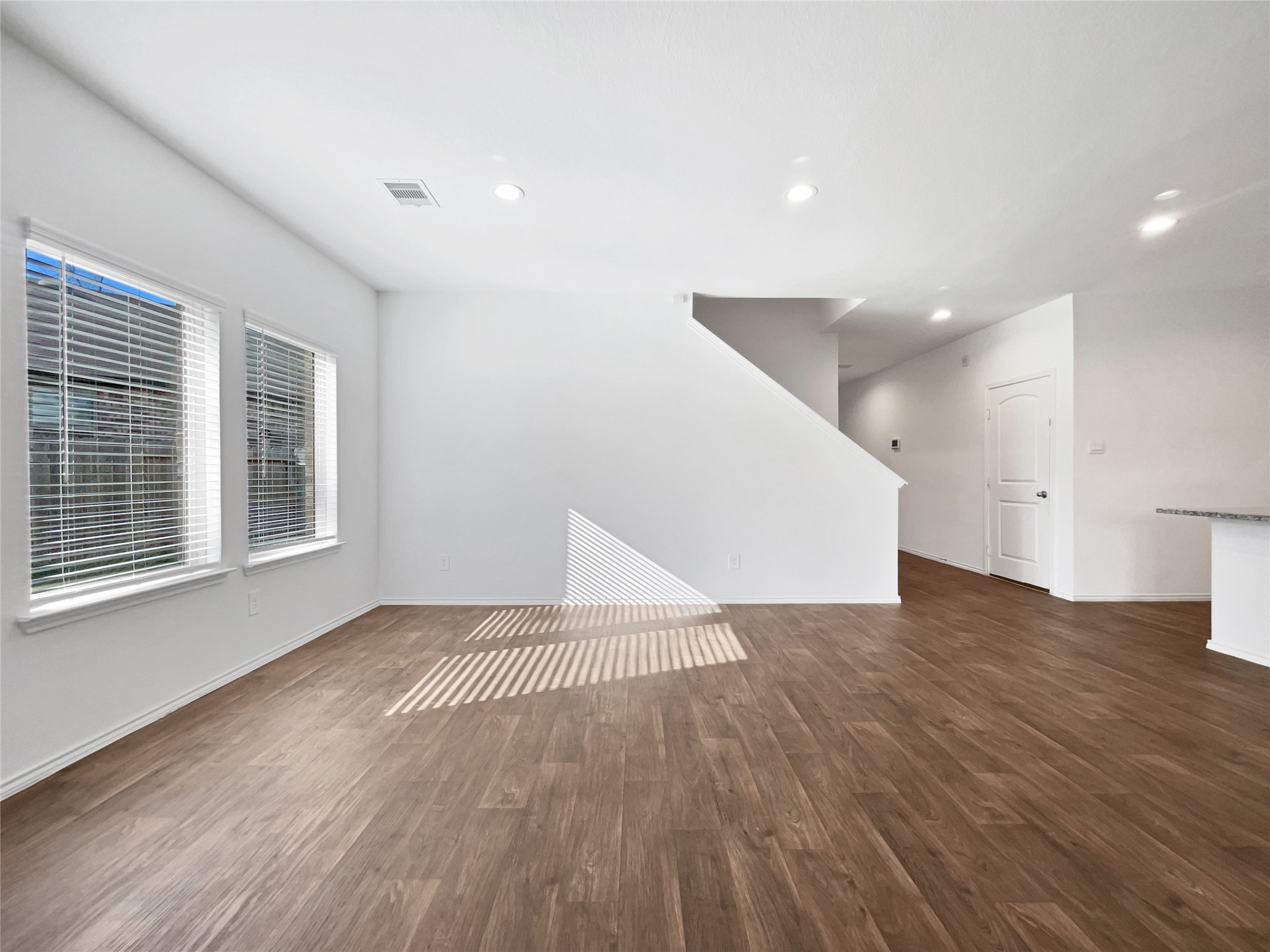 13912 Acadia Point Court Conroe, TX 77384 - Photo 3 of 19 a view of an empty room with wooden floor and a window