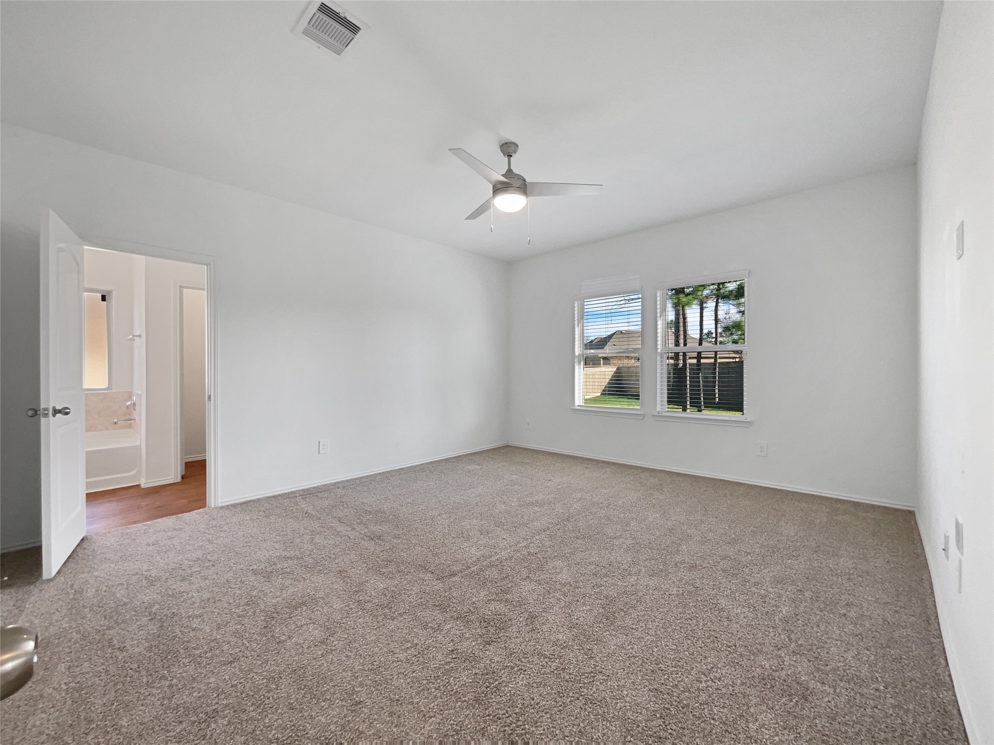 13912 Acadia Point Court Conroe, TX 77384 - Photo 4 of 19 a view of an empty room with a window