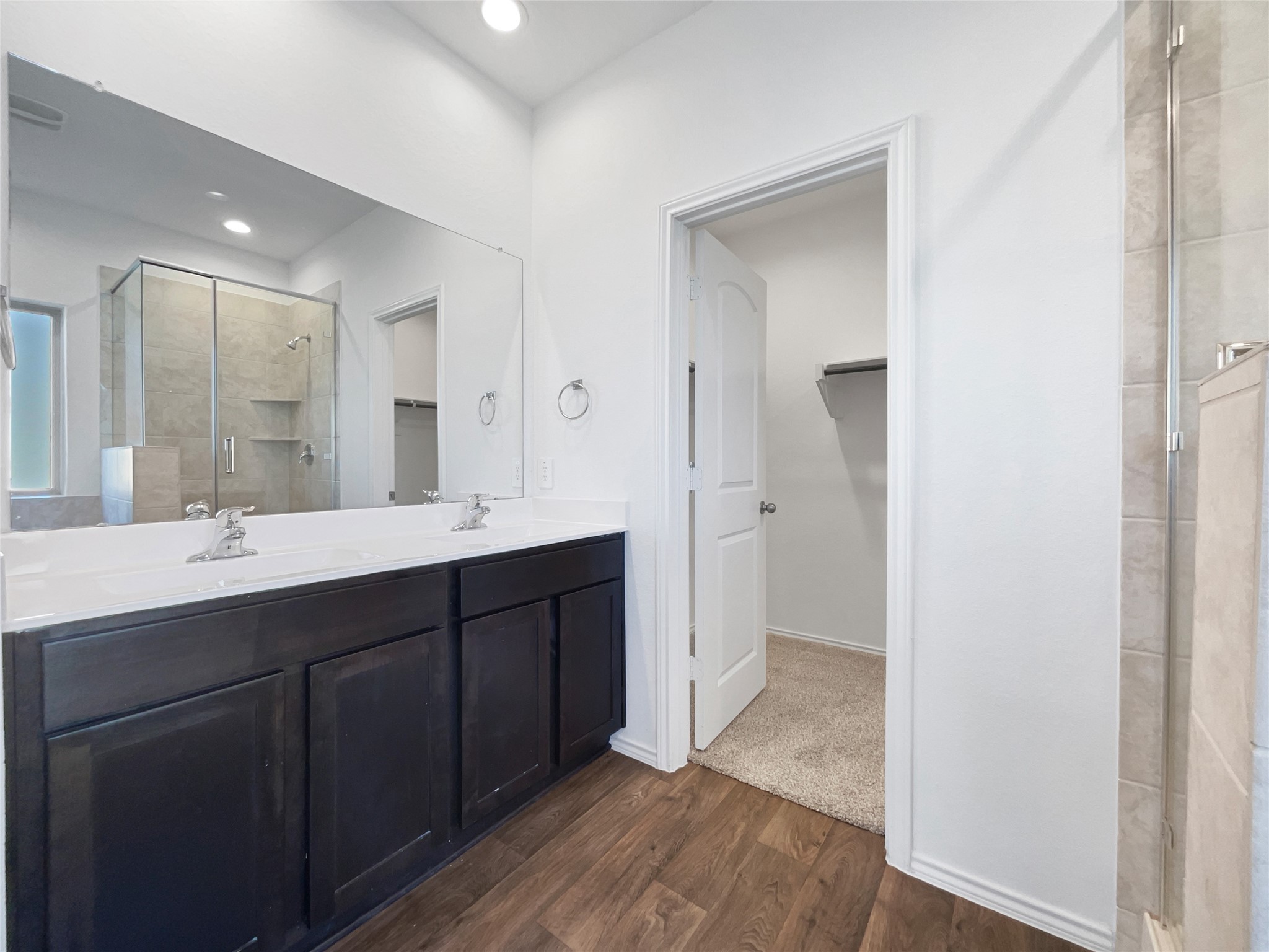 13912 Acadia Point Court Conroe, TX 77384 - Photo 6 of 19 a bathroom with a double vanity sink mirror and shower