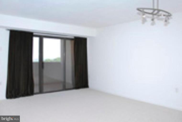 1301 North Courthouse Road, Unit 1204 Arlington, VA 22201 - Photo 4 of 8 an empty room with windows