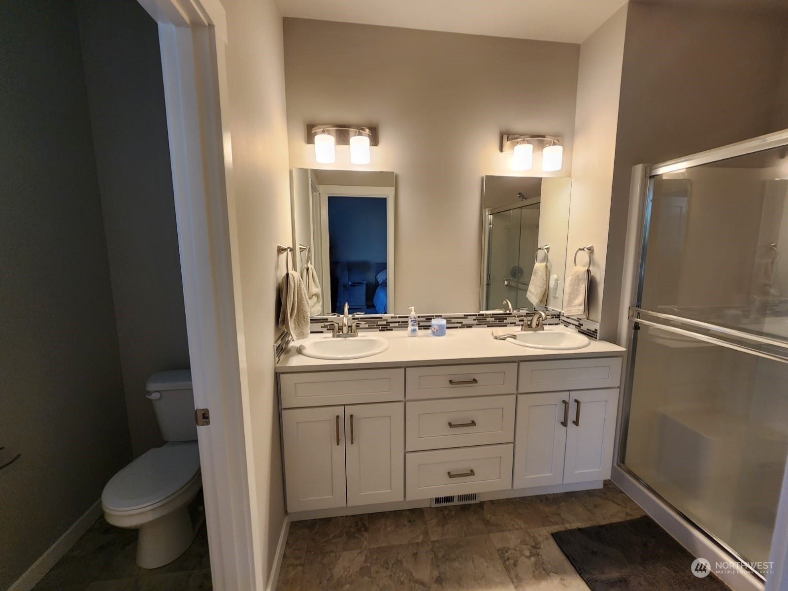 3297 Prill Road Centralia, WA 98531 - Photo 12 of 20 a bathroom with a double vanity sink toilet and mirror