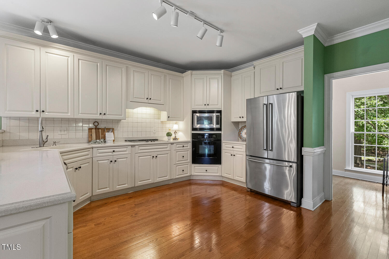 500 Potomac Grove Place Cary, NC 27519 - Photo 12 of 77 a kitchen with granite countertop a refrigerator sink and cabinets